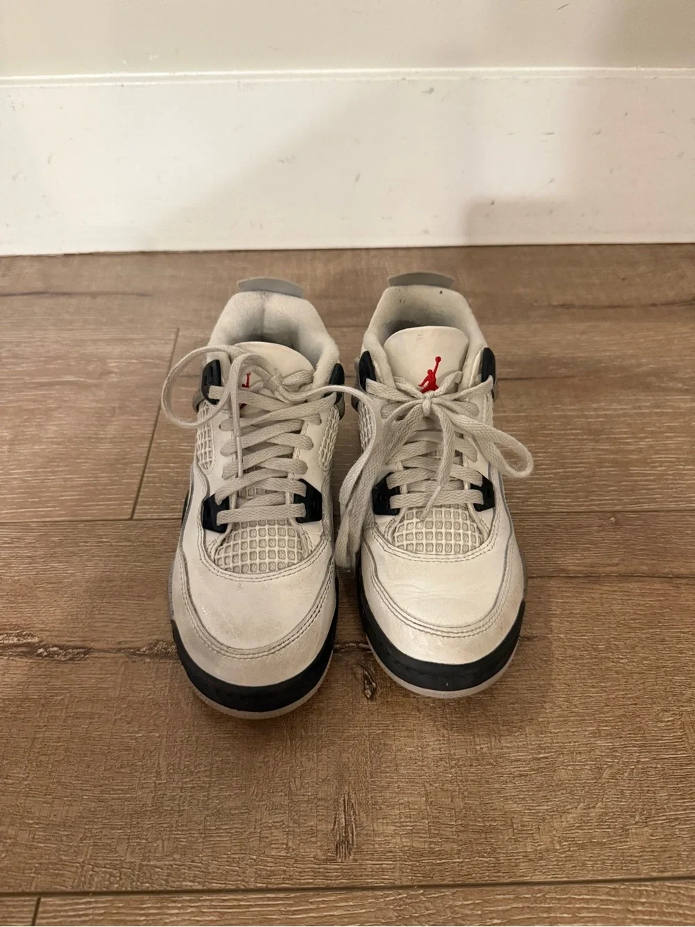 Air Jordan 4 Retro “White Oreo” in kids size 1Y.